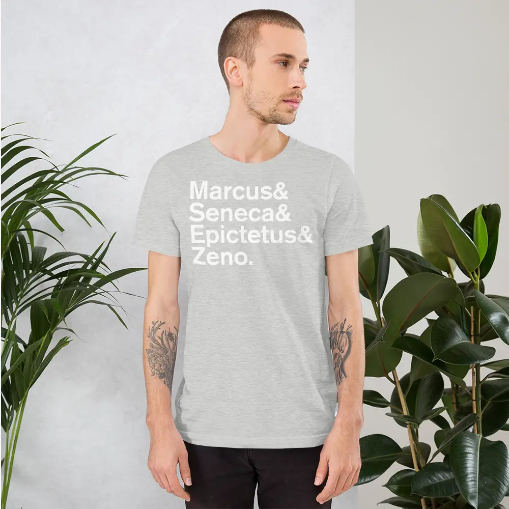 Man standing with grey tshirt with the names of famous stoic philosophers
